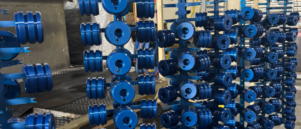 Metal Finishing Group Hanging Blue Parts